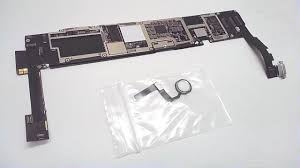 "Microscopic view of technician performing iPad logic board repair using micro-soldering station"