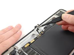 iPad speaker repair in progress with technician tools on desk Close-up of iPad microphone flex cable replacement at TekRenewed Disassembled iPad showing internal speaker and mic components Apple iPad being tested for sound issues after microphone repair